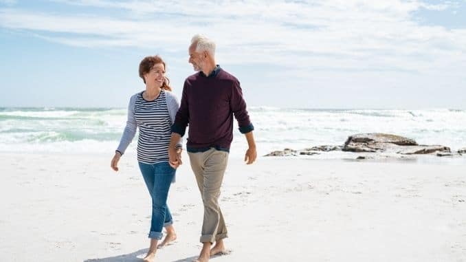 Middle aged couple enjoying beach