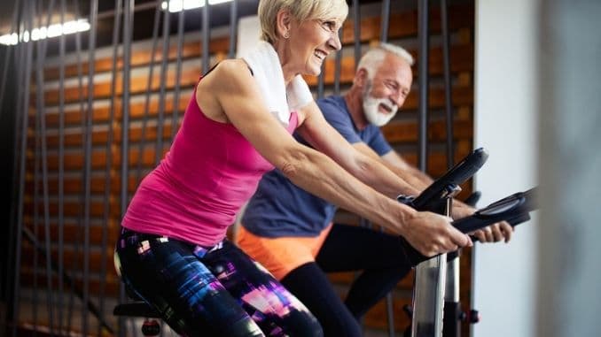 senior-couple-exercising-gym
