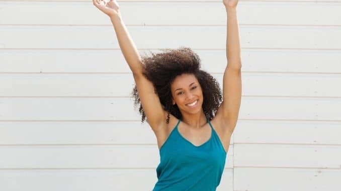 woman-arms-up- workout to reduce arm fat