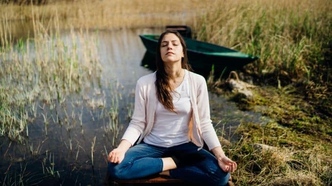 meditating-nature-escape-stressful- Breathing Techniques to Calm Anxiety
