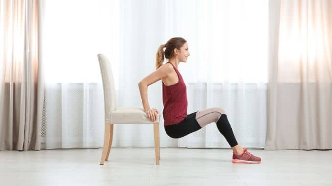 young woman exercising chair indoors-Lower Body Chair Workout