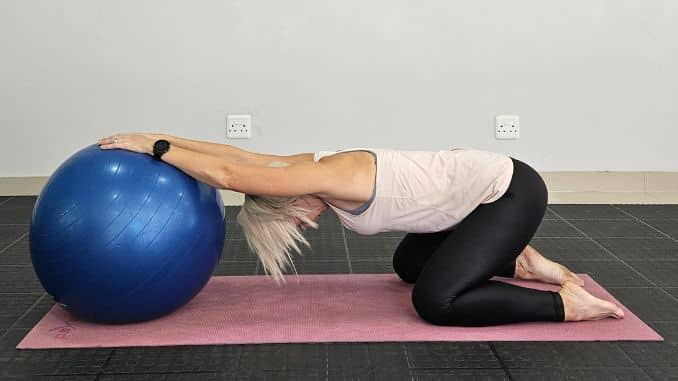 Wide-Legged Child's Pose with Stability Ball